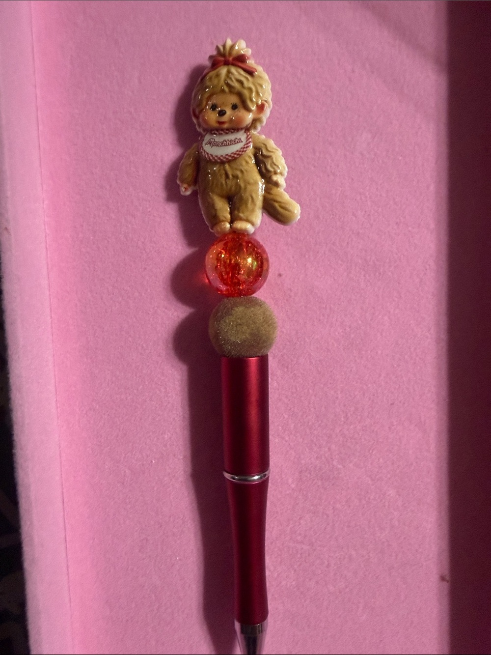 Red Monchichi beaded pen.